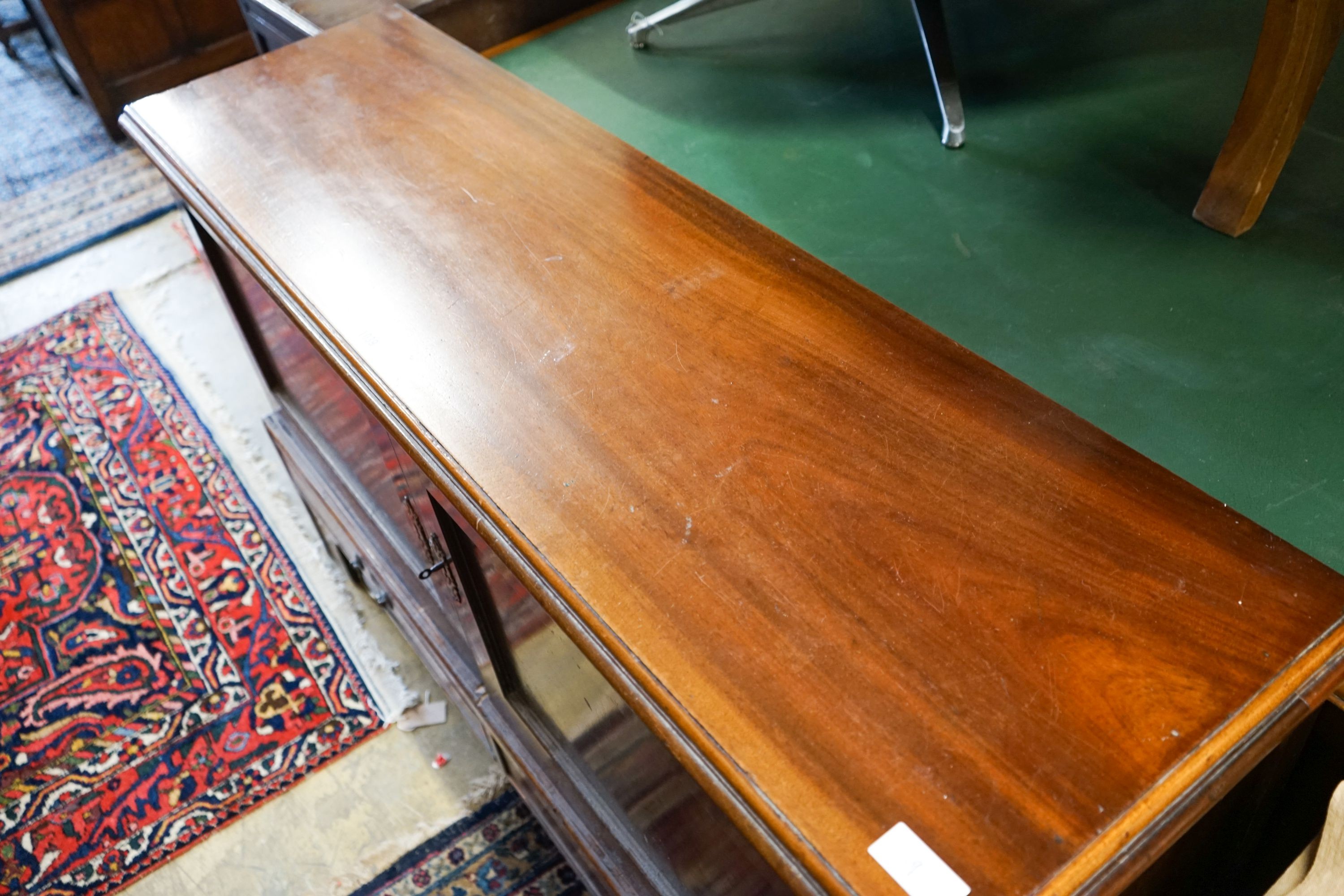 A George III mahogany dwarf cabinet constructed from old timber, width 140cm, depth 39cm, height 85cm